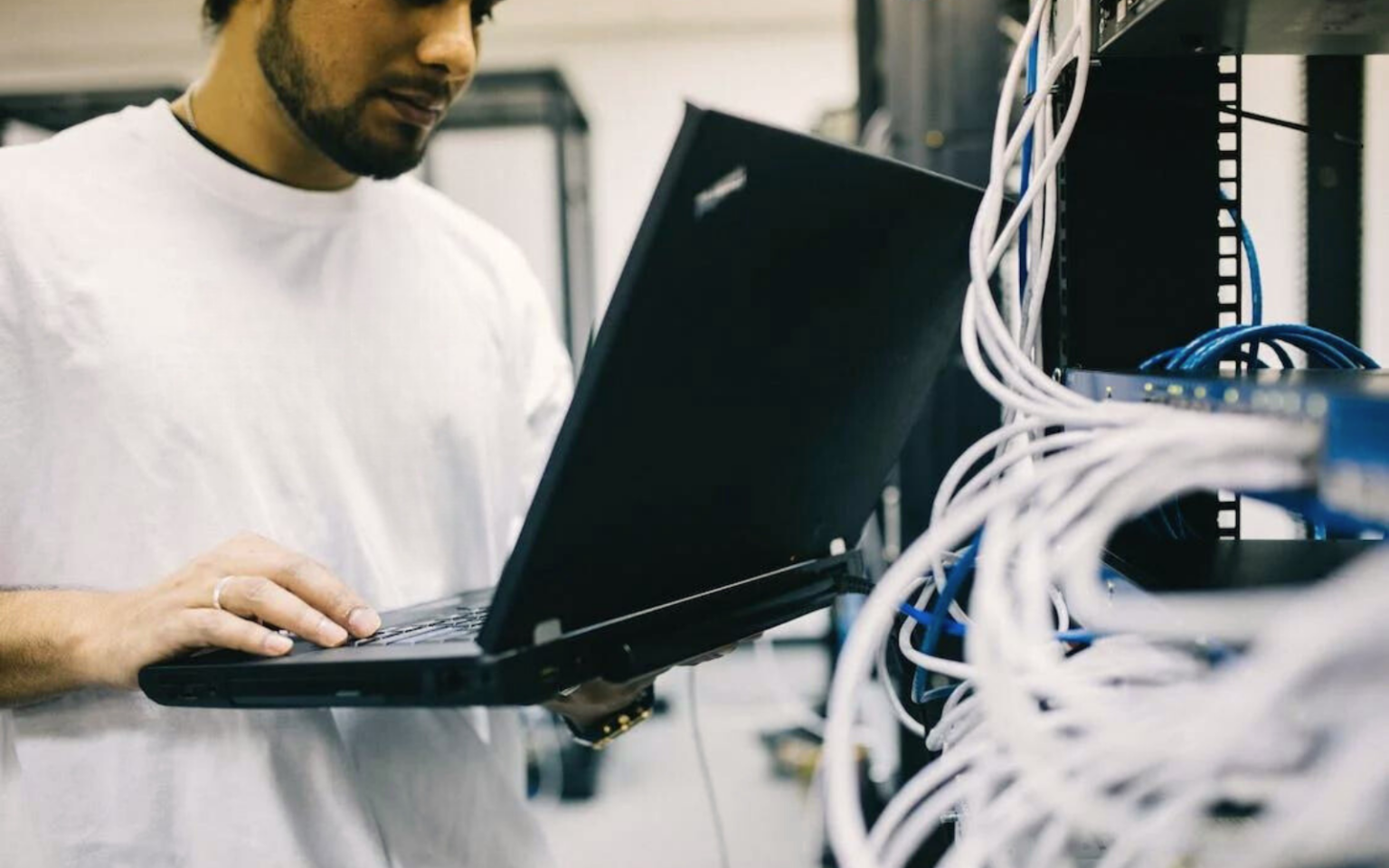 A network engineer at work, answering the question of what is a network engineer