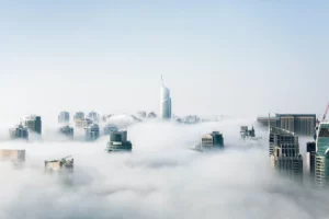 Clouds forming over a city where a cloud consultant is working