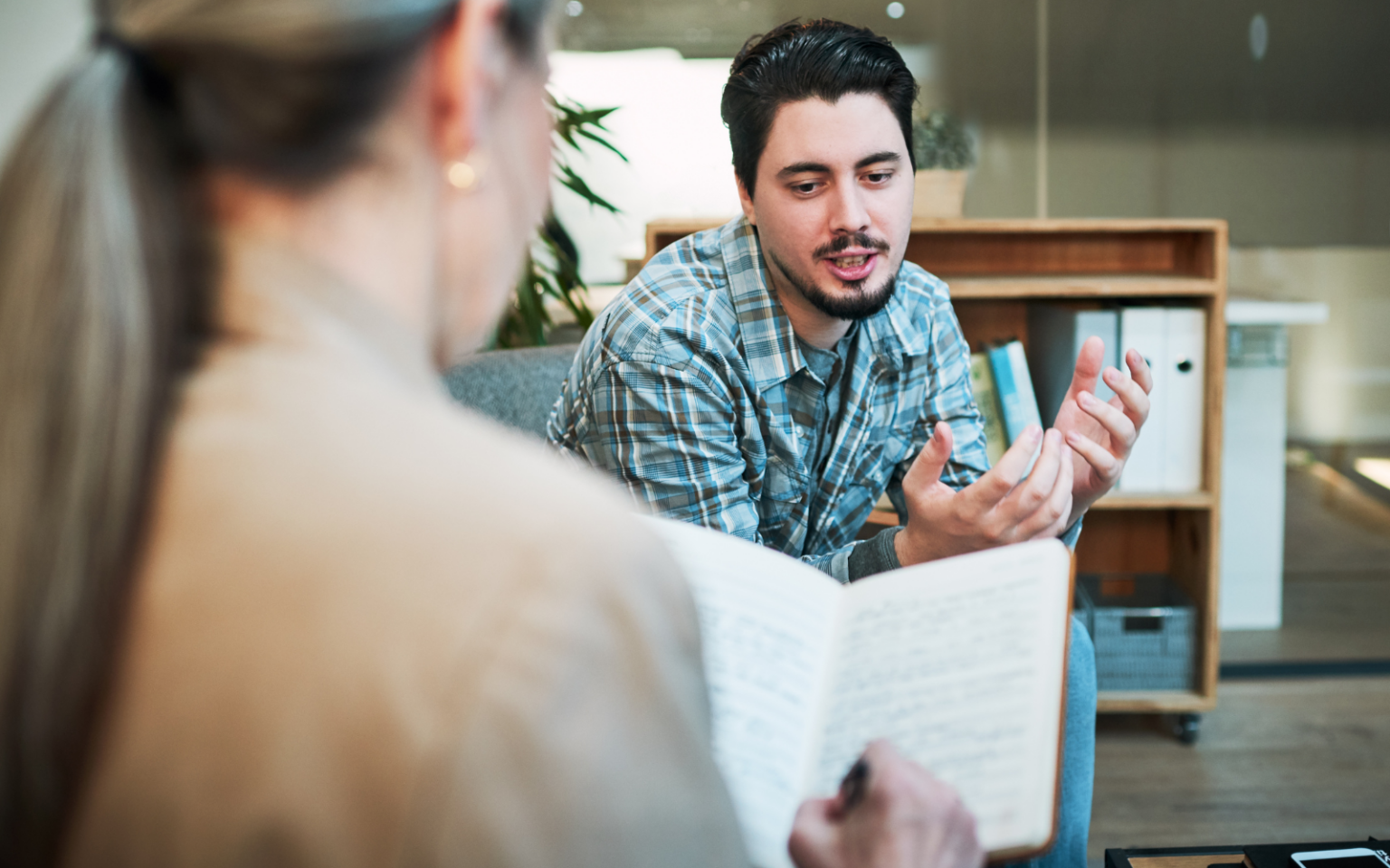 An employer working to support employees' mental health through catch up meetings