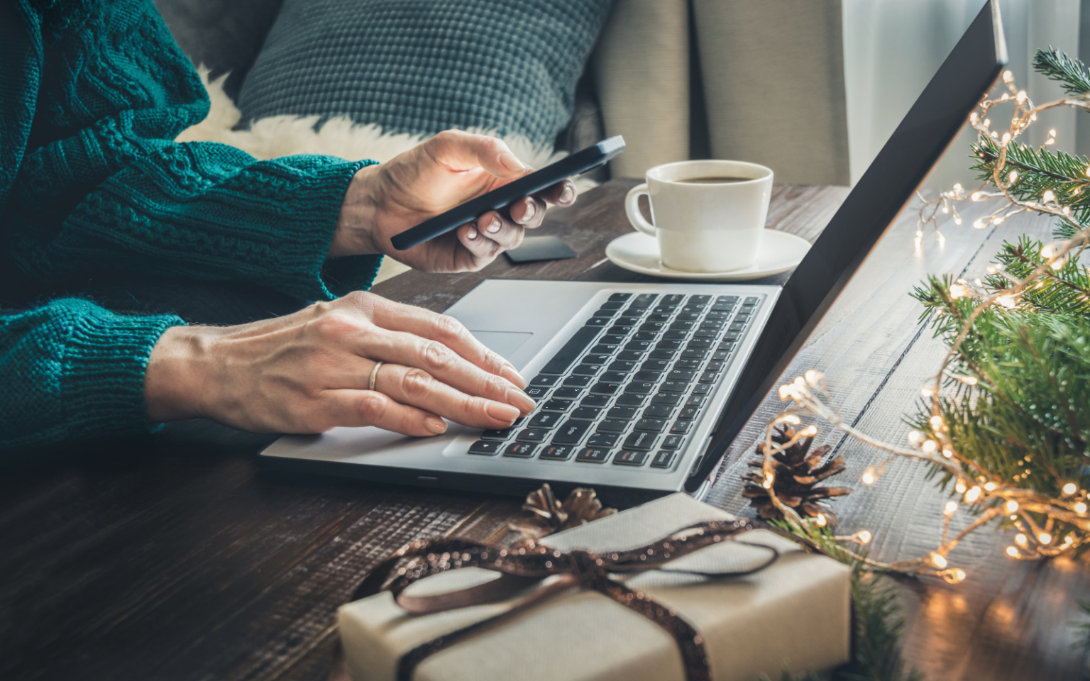 Person on laptop after deciding that hiring in december will be beneficial for their business