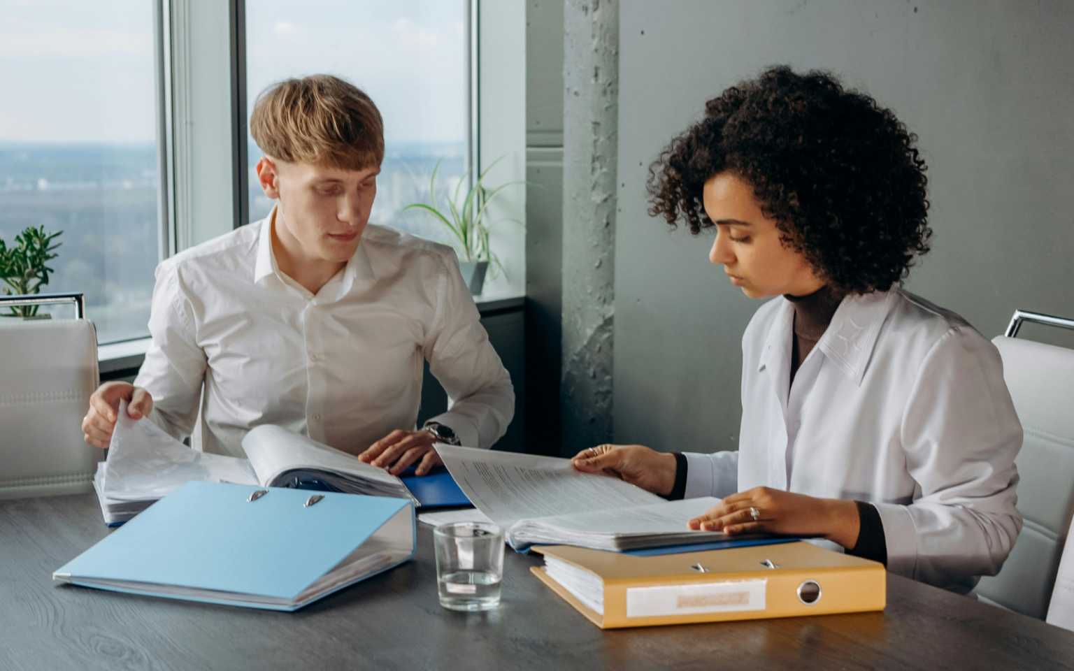 understanding how to attract gen Z employees will mean you have some great employees diligently doing work like the two pictured here